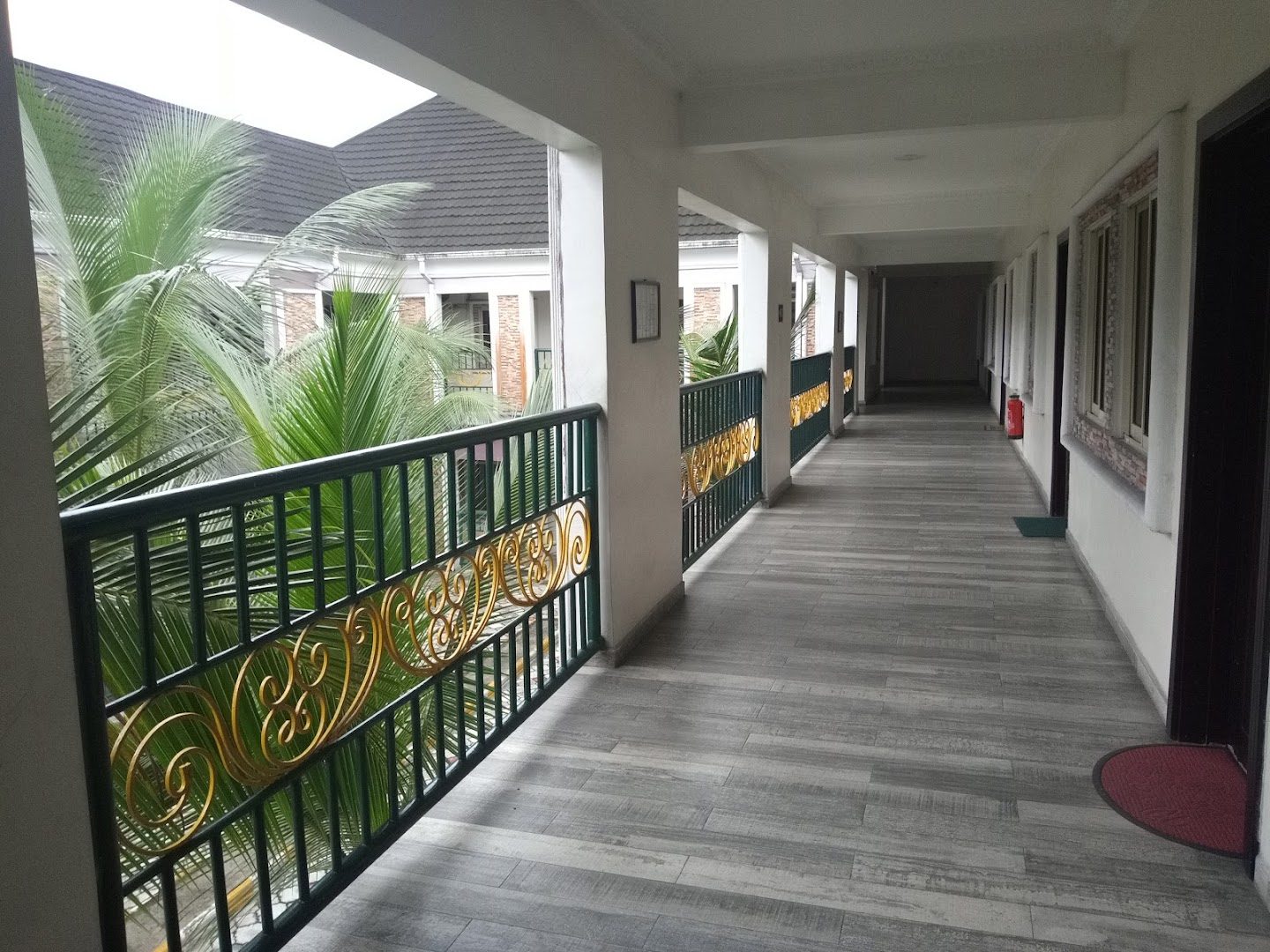 Elegant corridor and balcony with gold railings